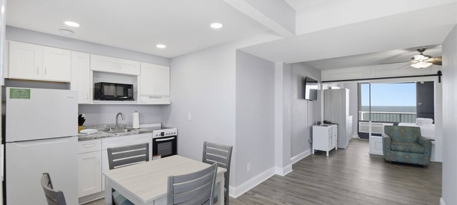 Beachfront Studio | Kitchen + Pool & Picnic Area in Ormond Beach