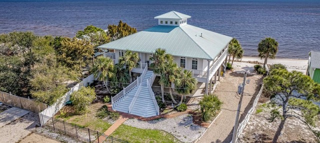 This Cape Cod style beauty will make you fall in love with the Forgotten Coast! in Alligator Point
